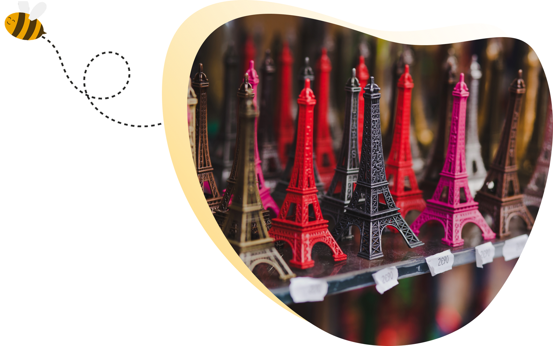 Colorful Eiffel Tower souvenirs on display shelf.